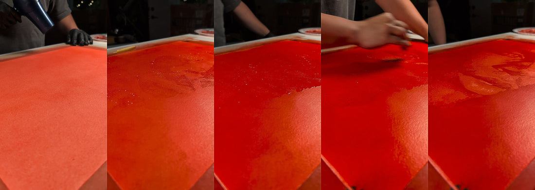 Stencil layers being removed to reveal a hidden Khabraal portrait painting during the masking process