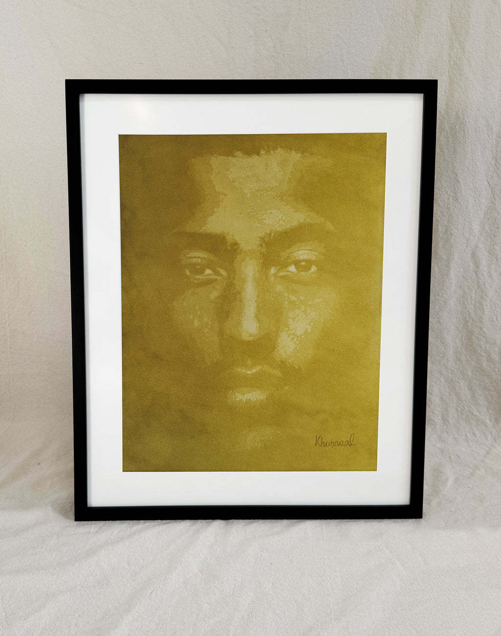 Framed view of John, an original acrylic portrait by Khabraal, shown in its museum frame