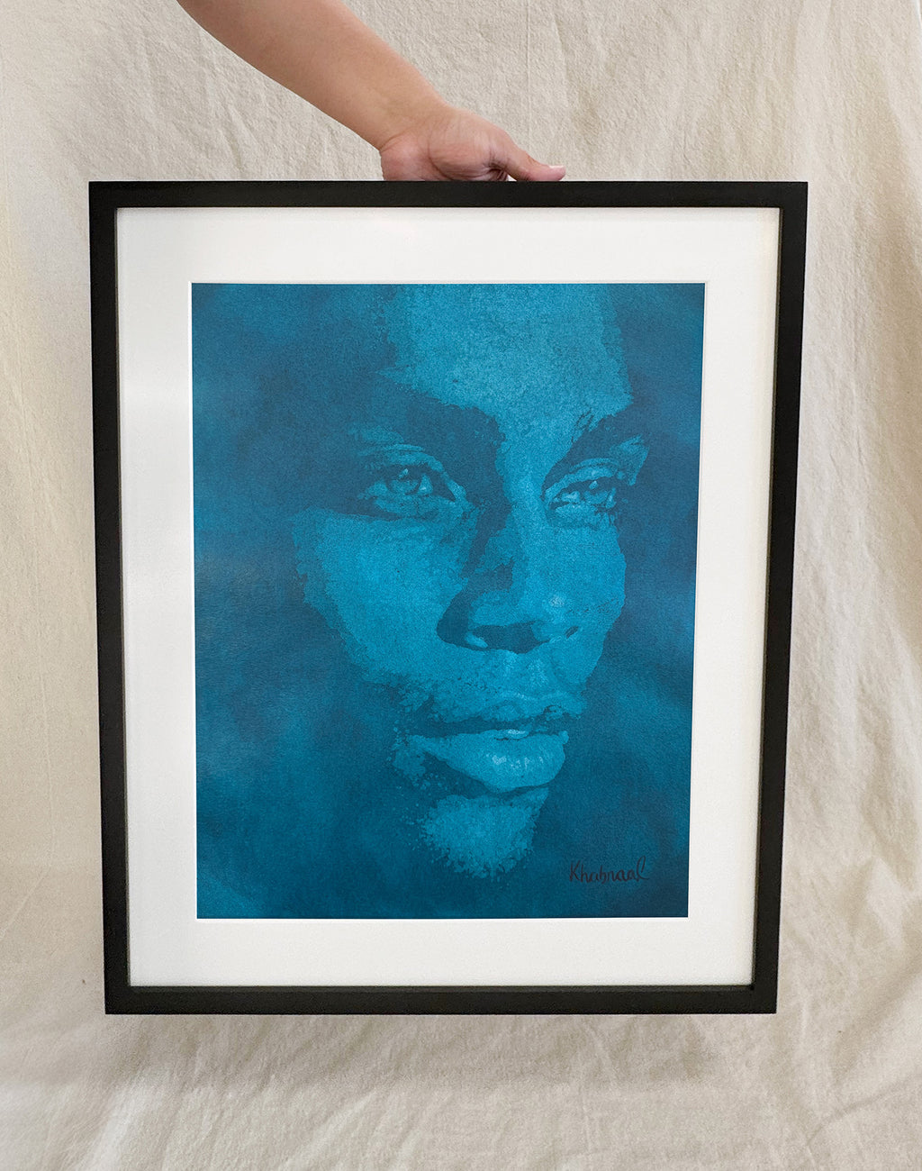Hand shown for scale against Michael, a 15.25 × 19.25 inch original acrylic portrait