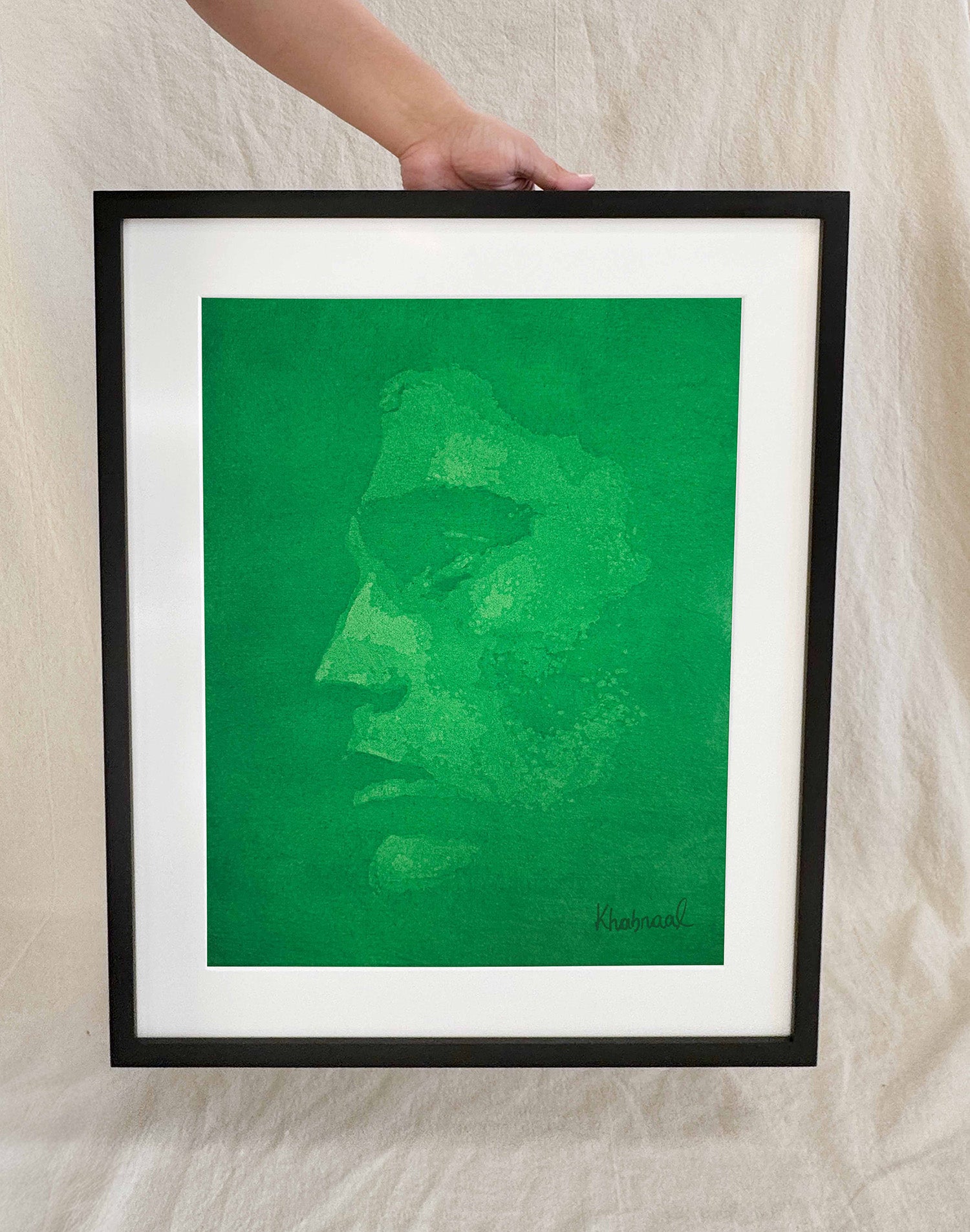 Hand shown for scale against Wesley, a 15.25 × 19.25 inch original acrylic portrait