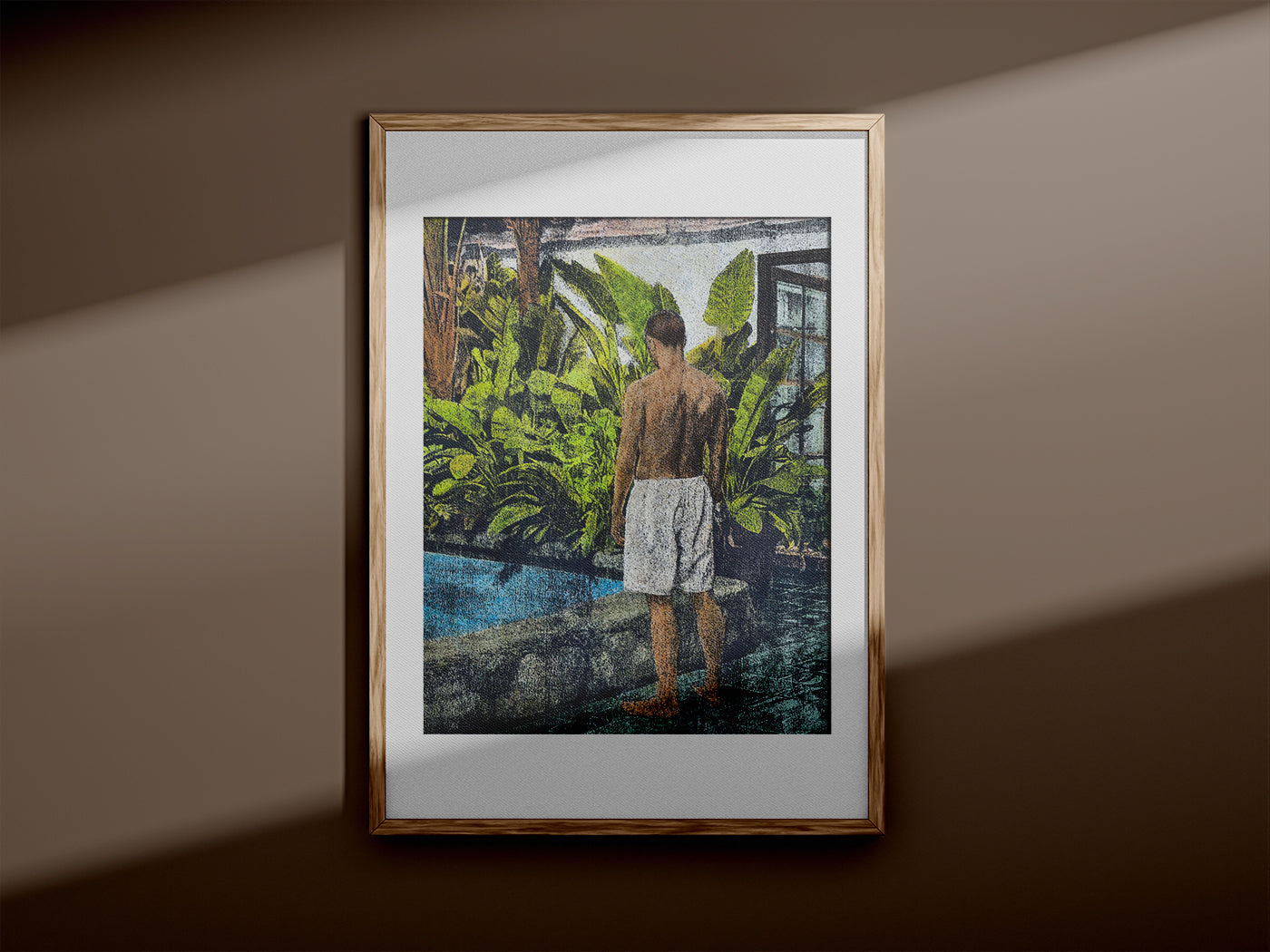 Framed monotype artwork of a man by a pool displayed on a wall with soft angled light.